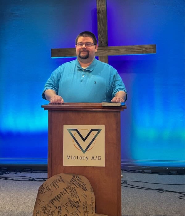 Pastor Jimmy Lewis at the church pulpit